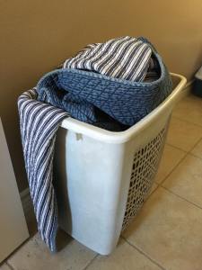 Remaining laundry in the overstuffed hamper